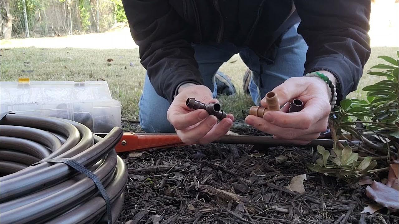 Fixing a drip irrigation line during landscape maintenance in Murrieta.