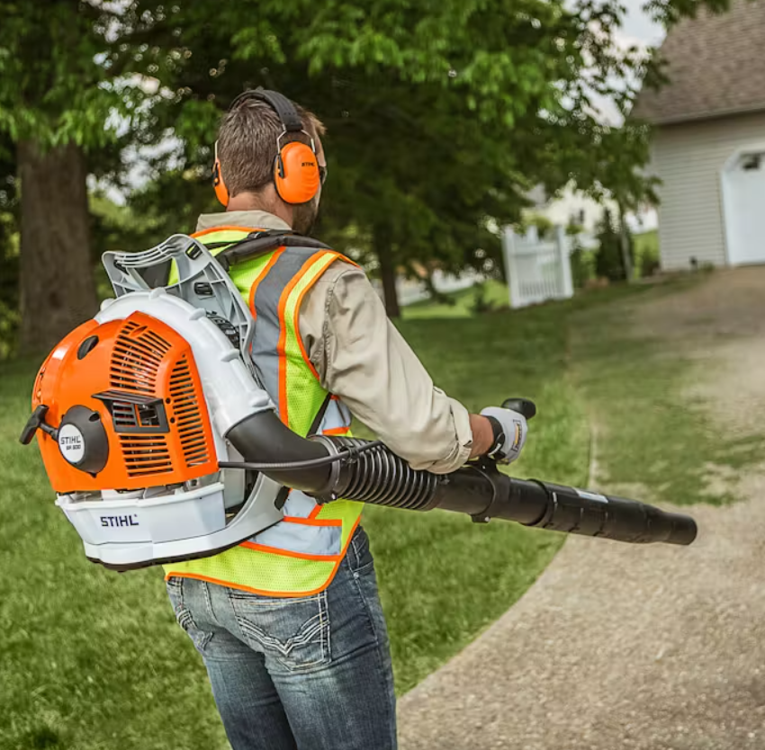 Backpack blower clearing debris during landscape maintenance in Murrieta.
